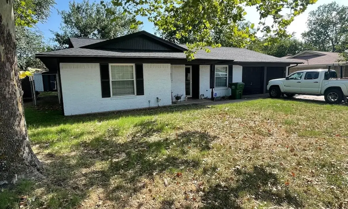 Professional roofing crew working on a residential roof in Waterford